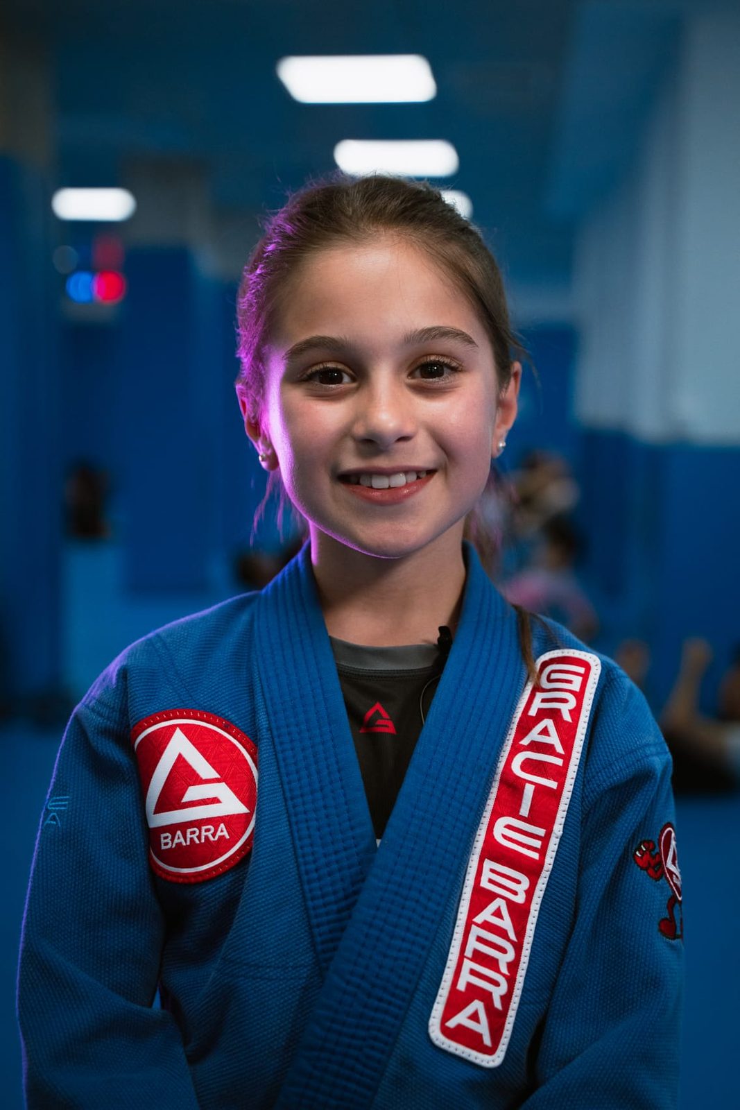 A young student in a Gracie Barra gi