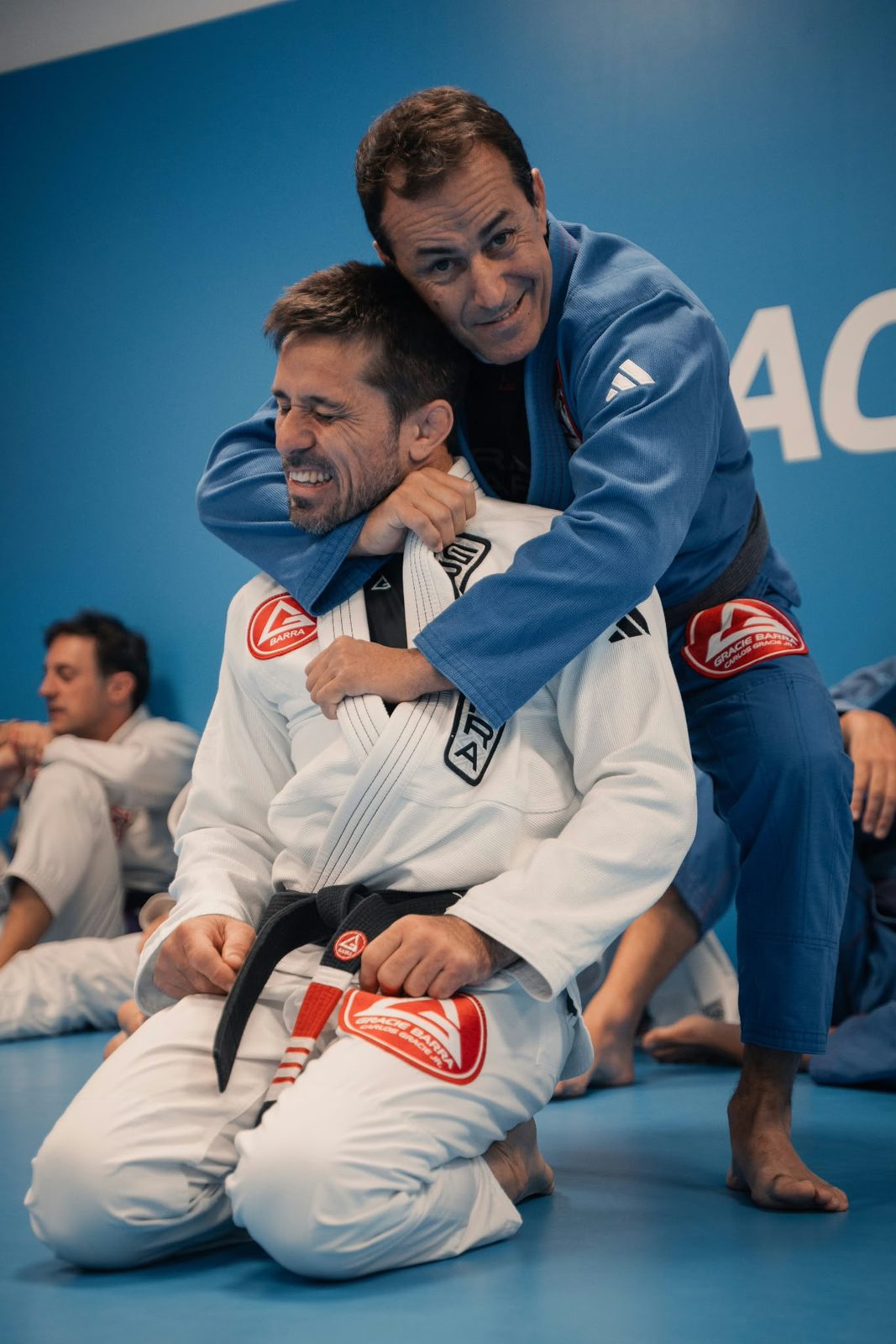 Instructor coaching a student through a technique